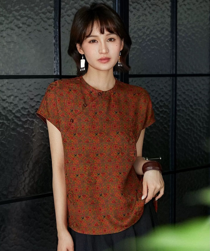 Top cheongsam in seta smeraldo con motivi geometrici