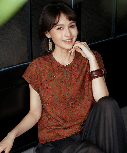 Top cheongsam in seta smeraldo con motivi geometrici