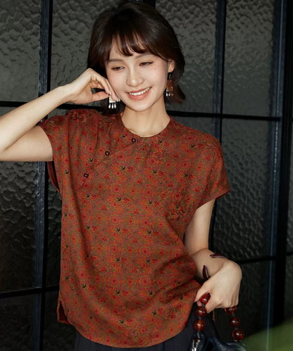 Top cheongsam in seta smeraldo con motivi geometrici